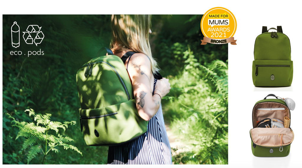 green diaper bag made from neoprene with pods system to make it easier to keep organised