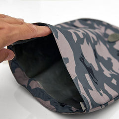 A persons hand opening the top of the pacadry bag