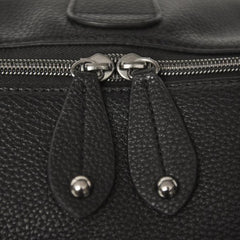 Close up view of the zip pulls on a Firenze Pack Black