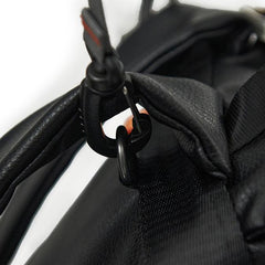 Close up of the back pack straps and the D ring where the pram clips attached to the bag